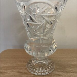 Vintage lead crystal vase featuring a prominent pinwheel cut pattern